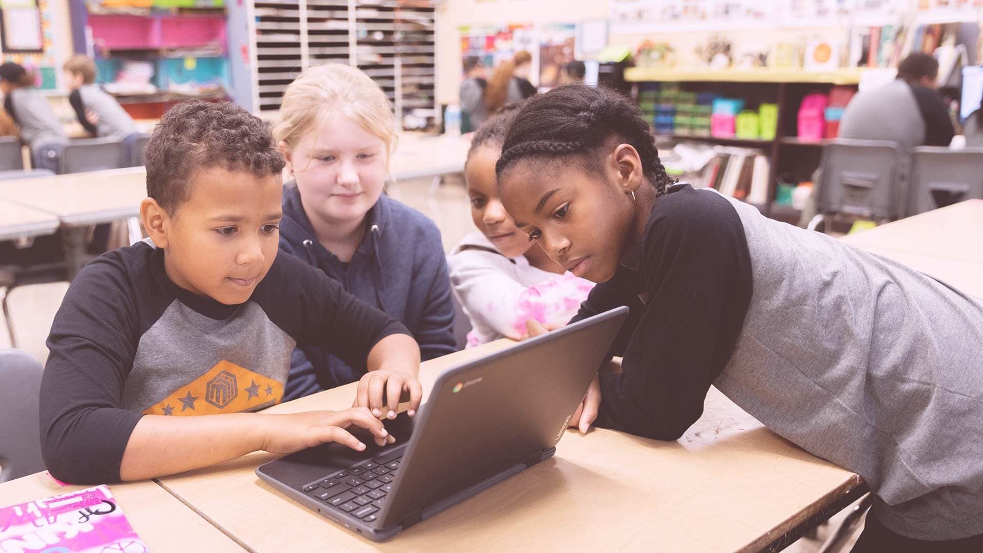 Youth Coding League kids working on a group project.